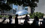 People take a break in the shade during a heatwave in downtown Chicago,&nbsp;on June 14.&nbsp;