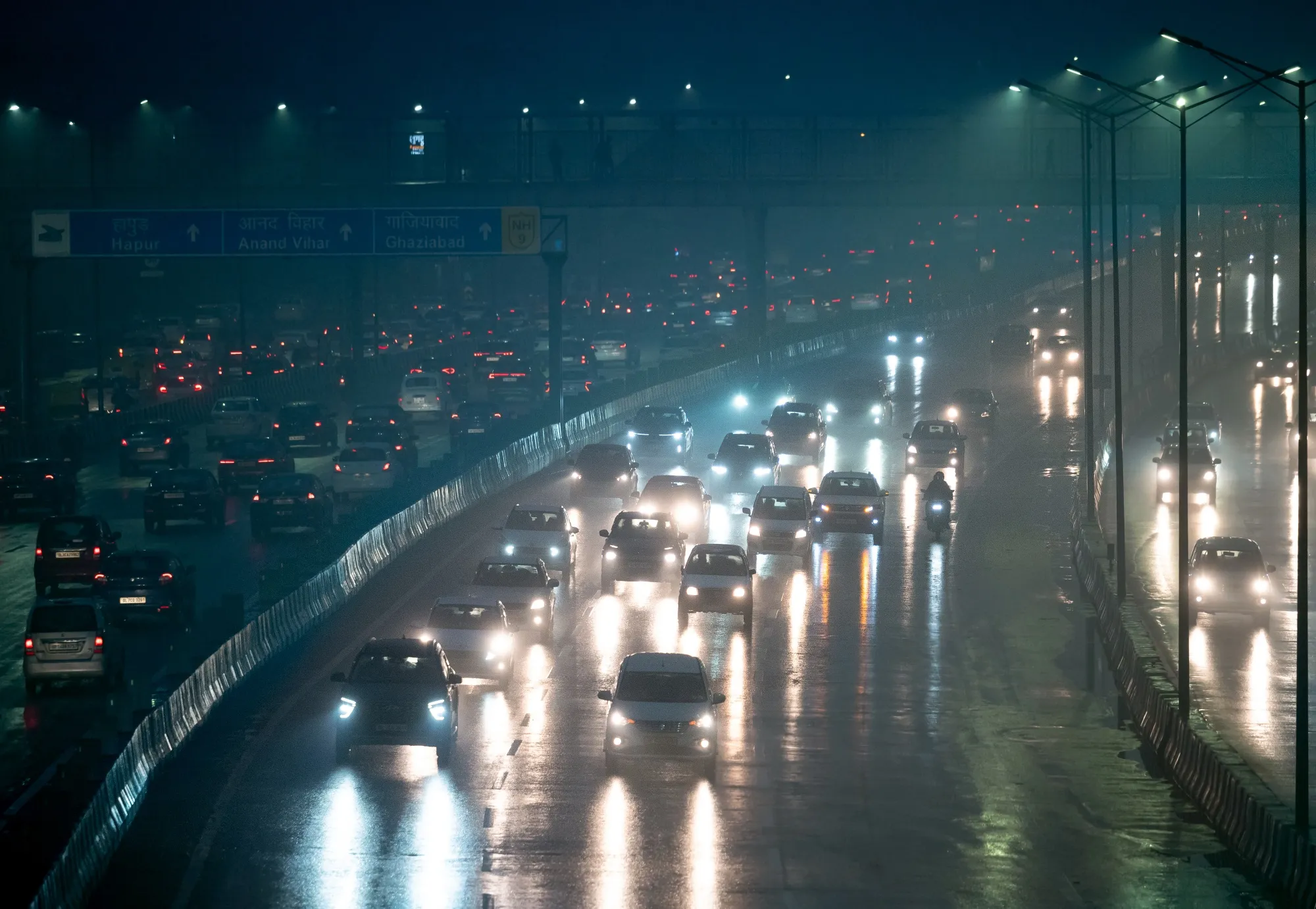 Vehicles travel on a highway in New Delhi, India.