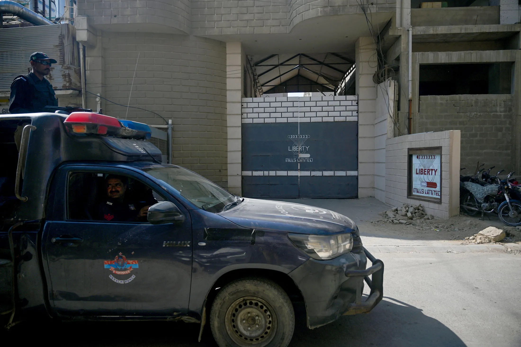 Police outside the factory where a&nbsp;security guard shot two Chinese nationals, in Karachi, on Nov. 5.