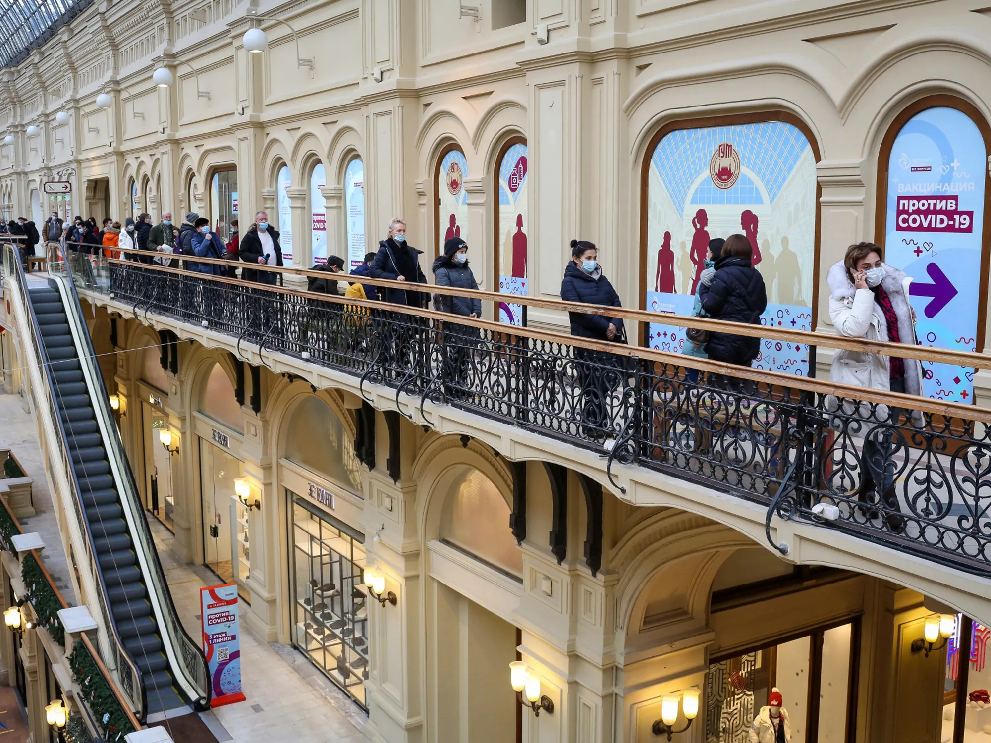 People queue outside a Covid-19 vaccination center inside a department store in Moscow.