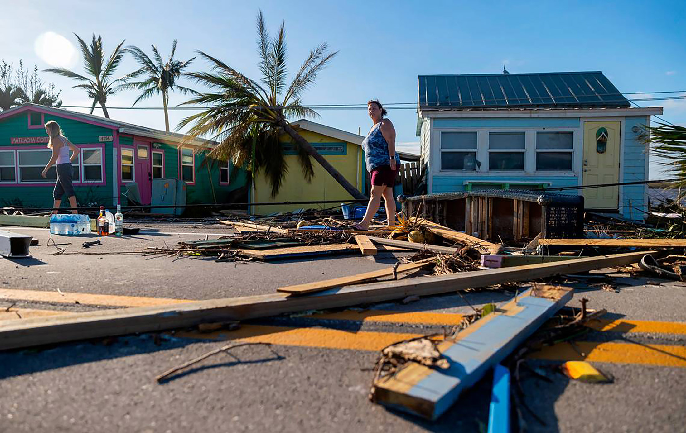 Donna LaMountain surveys damage on Pine Island Road in Matlacha, Florida, after Hurricane Ian made landfall in September 2022.