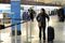 PHILADELPHIA, PA - NOVEMBER 26: Kenna Resnich, of Philadelphia, Pennsylvania walks with her luggage to catch her flight to Boston, Massachusetts at Philadelphia International Airport November 26, 2014 in Philadelphia, Pennsylvania. A winter storm caused some travel delays at the airport on the eve of Thanksgiving. (Photo by William Thomas Cain/Getty Images)
