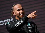 Lewis Hamilton celebrates on the podium following the&nbsp;French Formula One Grand Prix at the Circuit Paul-Ricard in Le Castellet, on July 24.