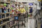 A customer wearing a protective mask shops inside a&nbsp;grocery store in San Diego, California.