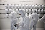 Employees prepare to enter a clean room&nbsp;inside the Infineon Technologies AG&nbsp;semiconductor factory in Villach, Austria.