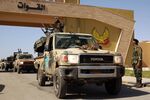 Members of the self-proclaimed eastern Libyan National Army (LNA) special forces gather in the city of Benghazi, on their way to the city of Sirte, on June 18.