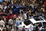 Visitors look at BYD Co. electric vehicles at the carmaker's booth at the Auto Shanghai 2021 show in Shanghai, China