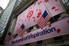American flags fly near Pinterest Inc. signage displayed outside of the New York Stock Exchange (NYSE).