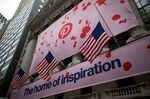 American flags fly near Pinterest Inc. signage displayed outside of the New York Stock Exchange (NYSE).