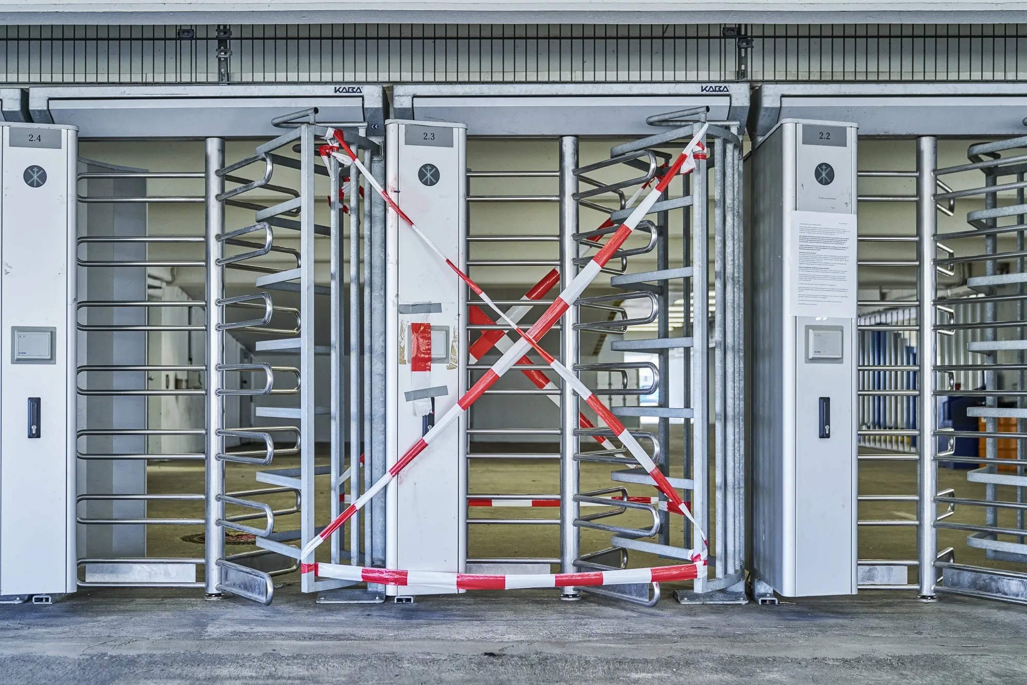 Tape sits across staff entrance turnstile gates at the Ford Motor Co. factory as coronavirus halts the automaker's German automobile assembly operations in Cologne, on March 24.