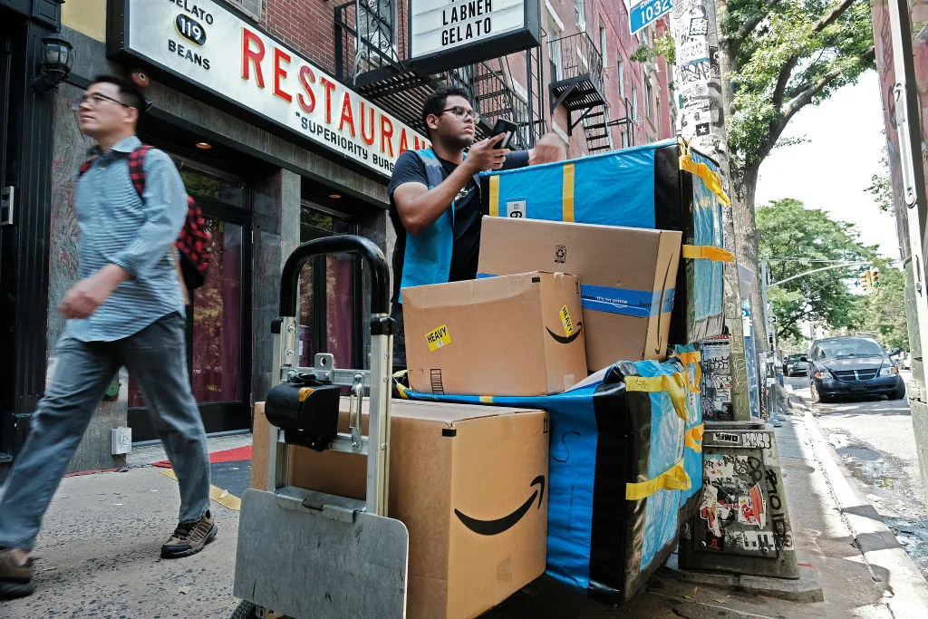 An Amazon worker moves boxes on Amazon Prime Day on July 11.&nbsp;