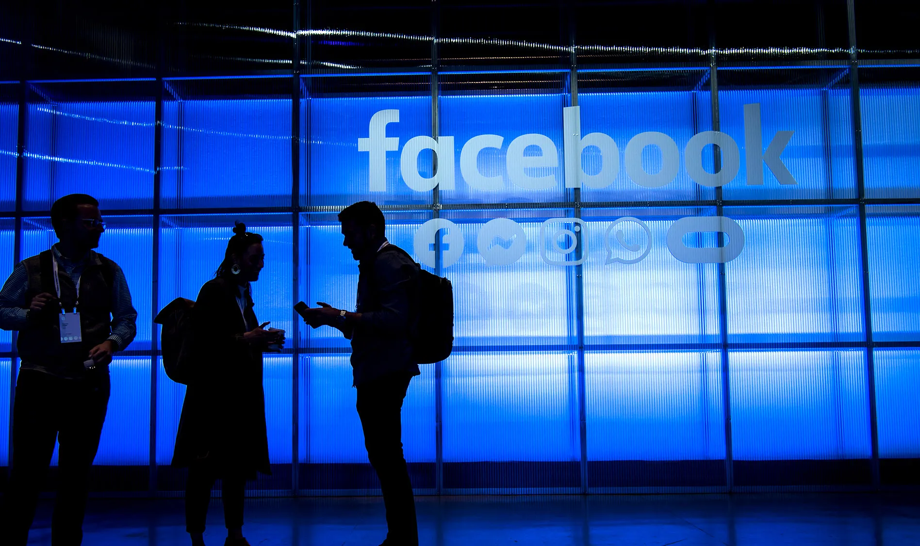 Attendees stand in the demonstration room during the F8 Developers Conference in San Jose, California.