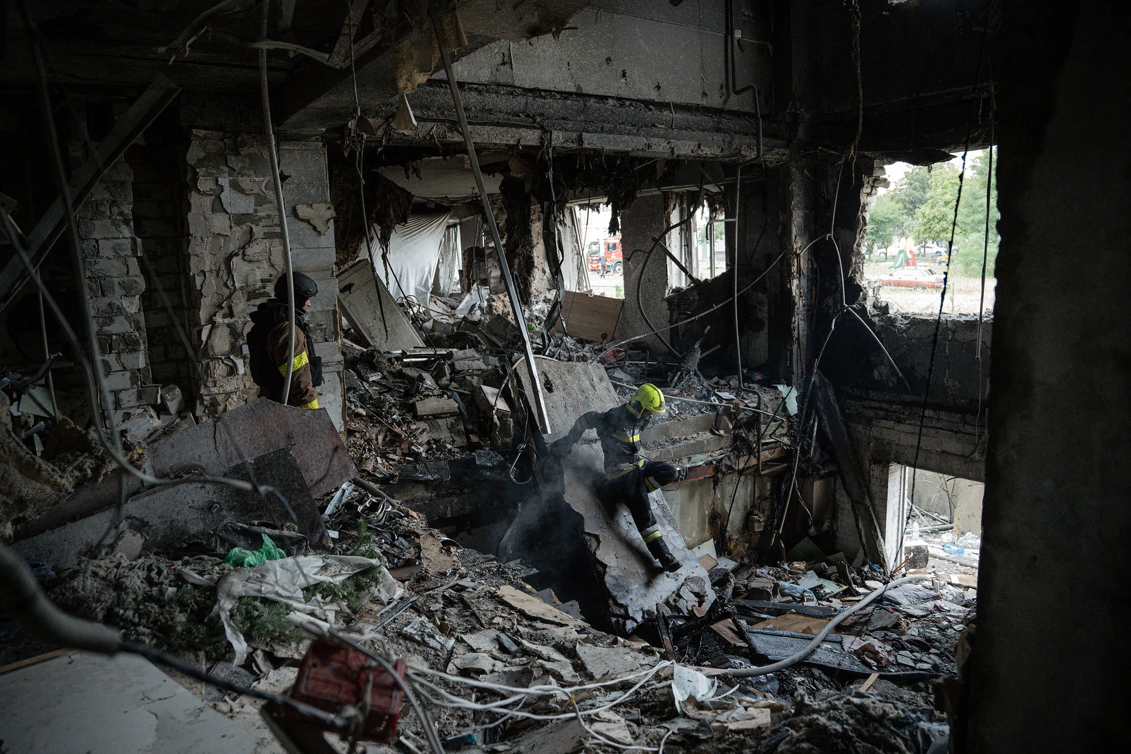Rescuers work inside a destroyed residential building after an air strike in Kharkiv, Ukraine, on Aug.&nbsp;18.