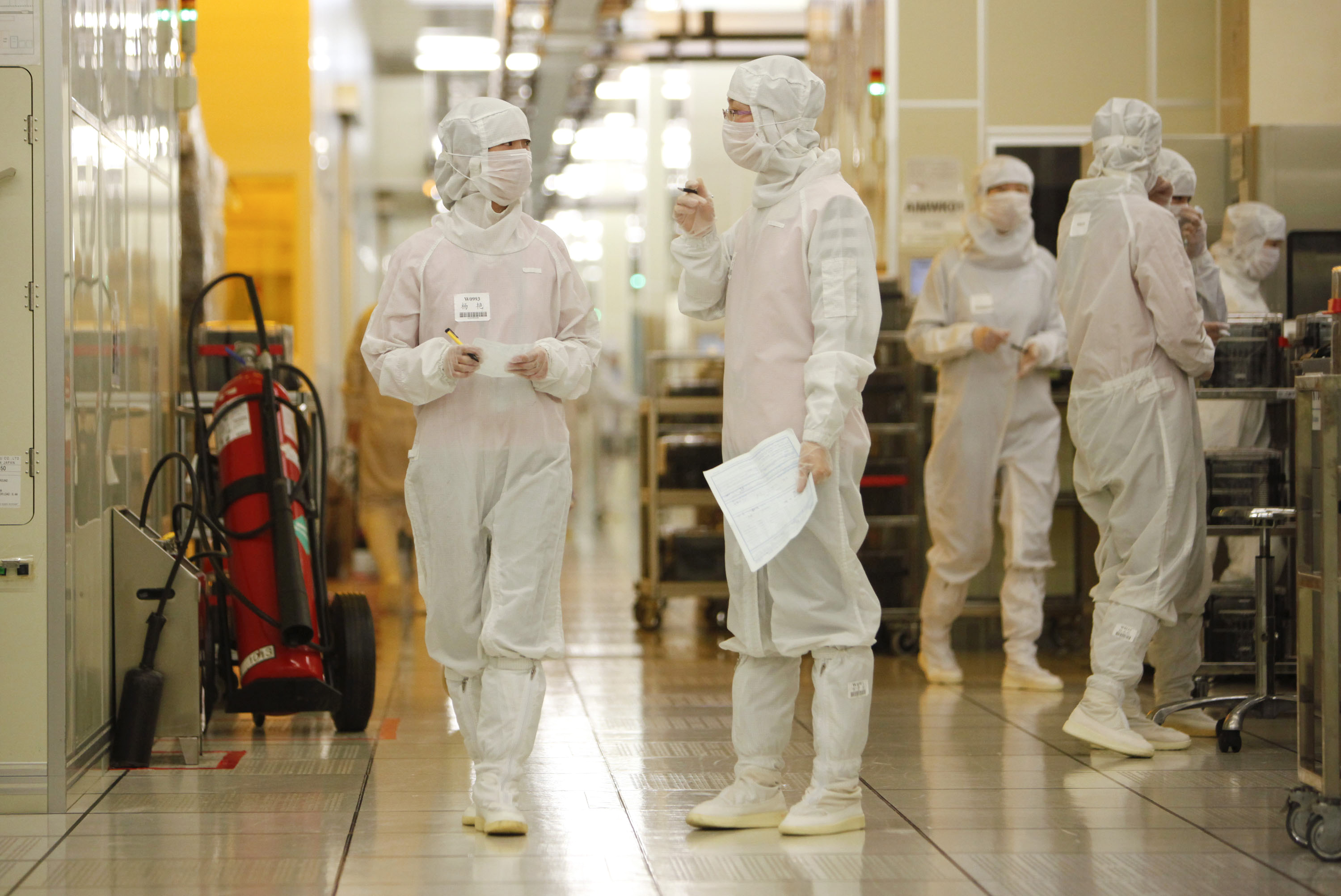 The employees operate at Semiconductor Manufacturing International Corp. in Shanghai.