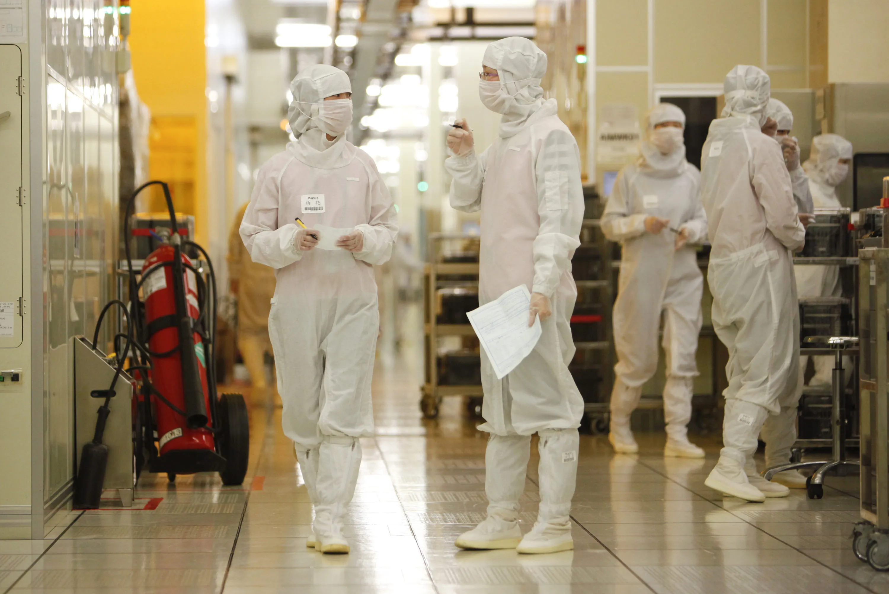 Employees operate at Semiconductor Manufacturing International Corp. in Shanghai.