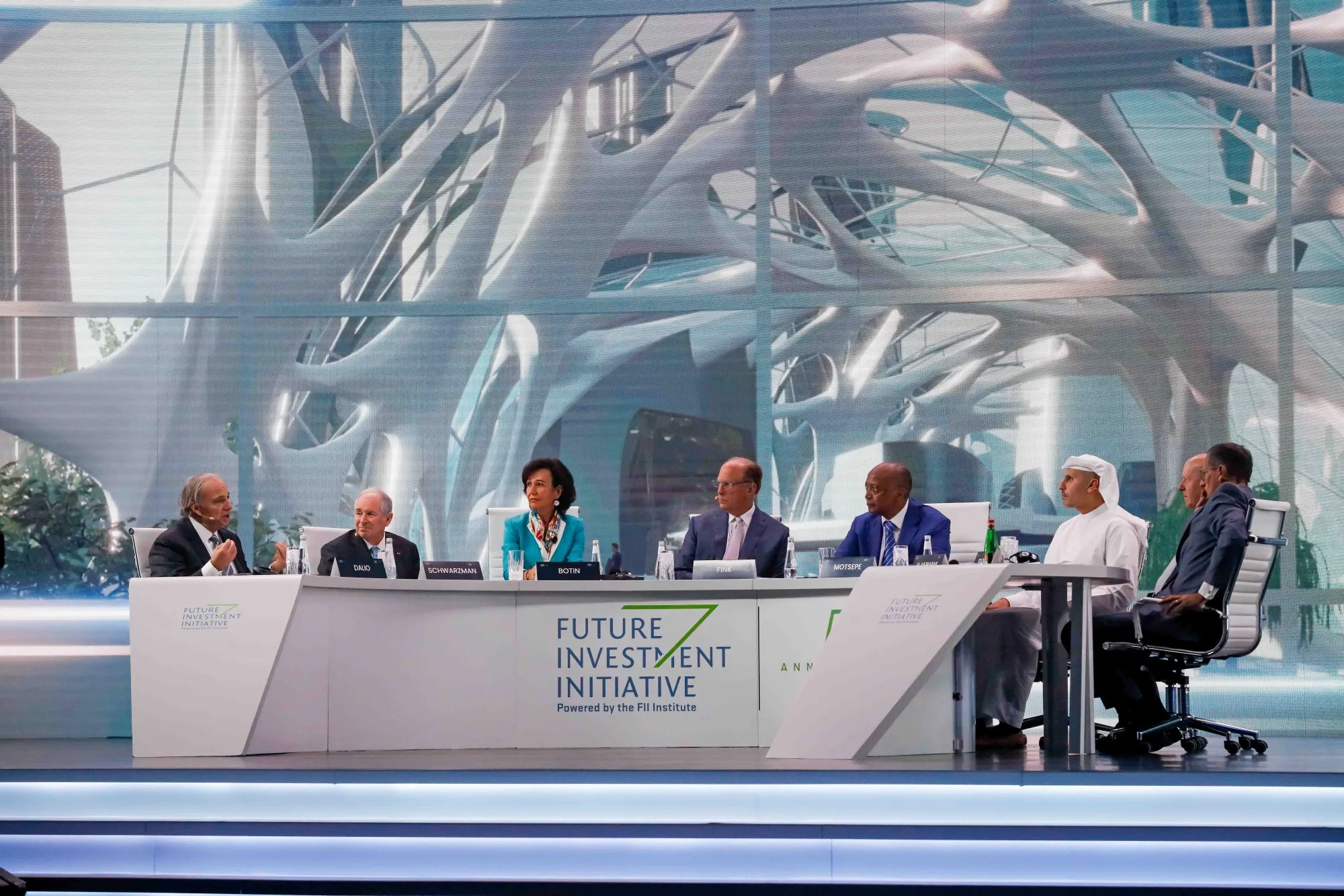 From left, Ray Dalio, Stephen Schwarzman, Ana Botin, Larry Fink, Patrice Motsepe, Khaldoon Al Mubarak, David Solomon and Richard Quest during the opening panel of the FII on Oct. 26.