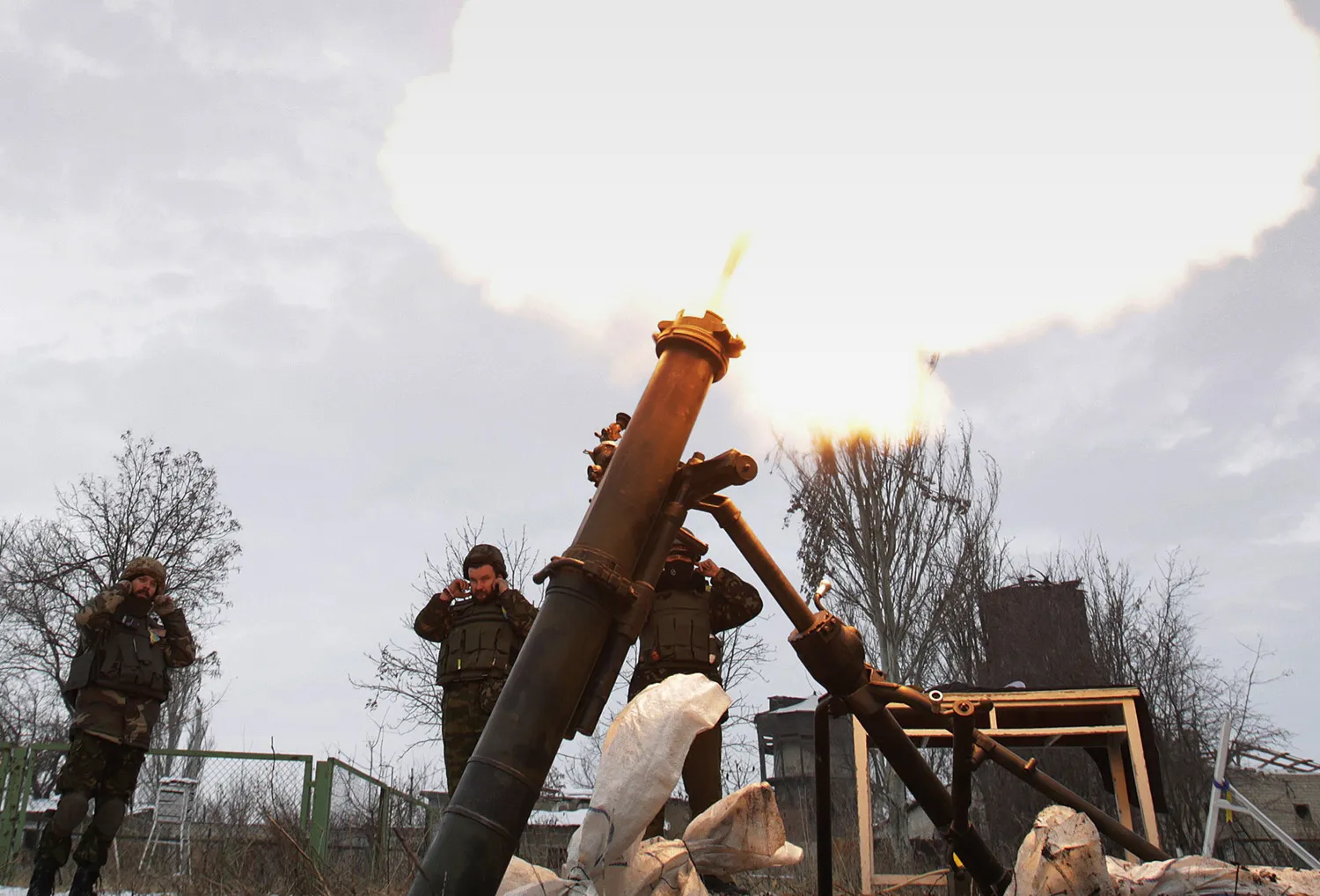 Ukrainian servicemen fire a mortar from their position near the eastern Ukrainian village Pisky, Donetsk region at the position of pro-Russian separatists at Donetsk airport on Dec. 8, 2014.
