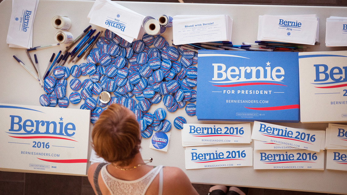 A supporter of Democratic presidential candidate Senator Bernie Sanders (I-VT) looks over campaign materials at a town hall meeting hosted by the candidate at Valley High School on July 24, 2015 in West Des Moines, Iowa.
