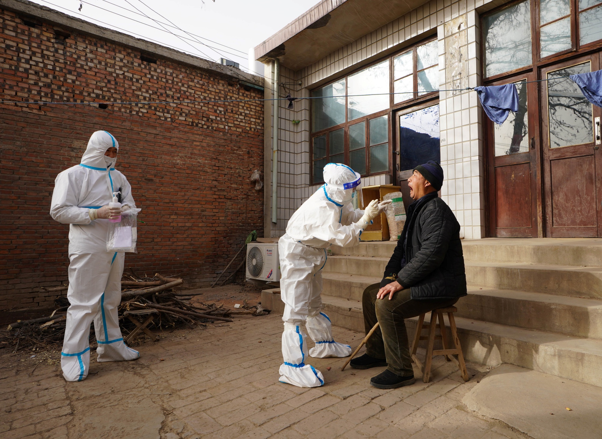 A villager at Shizhuang Village undergoes Covid-19 testing in Shijiazhuang City, Hebei Province, Jan. 12.