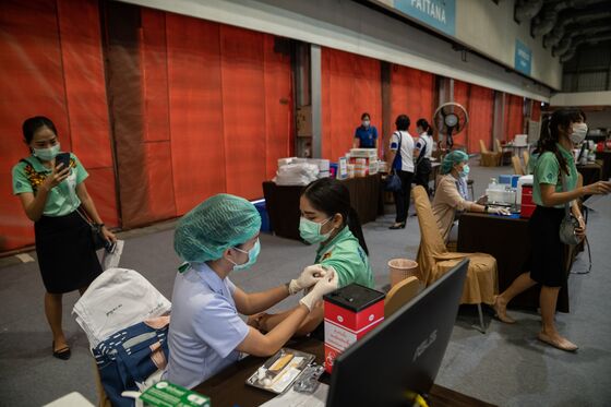 Vaccine Tourists Urged to Read Fine Print on Trips Overseas