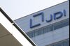 The Japan Display Inc. logo is displayed atop the company's plant in Mobara, Chiba Prefecture, Japan.