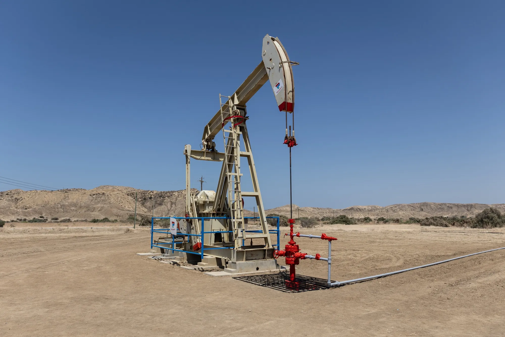 A pump jack at an oil lot connected to the Petroleos del Peru SA Talara refinery in Piura, Peru.