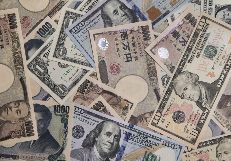 Japanese 10,000 yen and U.S. 100 dollar banknotes are arranged for a photograph in Tokyo, Japan, on Monday, June 20, 2016. Japanese shares fell, with the Topix index dropping for the first time in three days, as the yen rose ahead of the U.K. decision on European Union membership and investors awaited testimony from Federal Reserve Chair Janet Yellen.