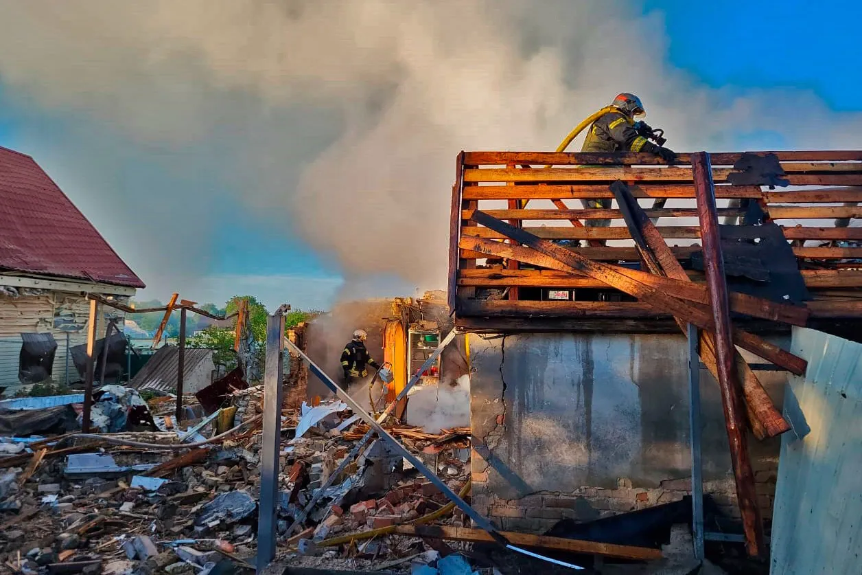 Emergency services at the scene following a Russian attack in the Kyiv region on May 8.