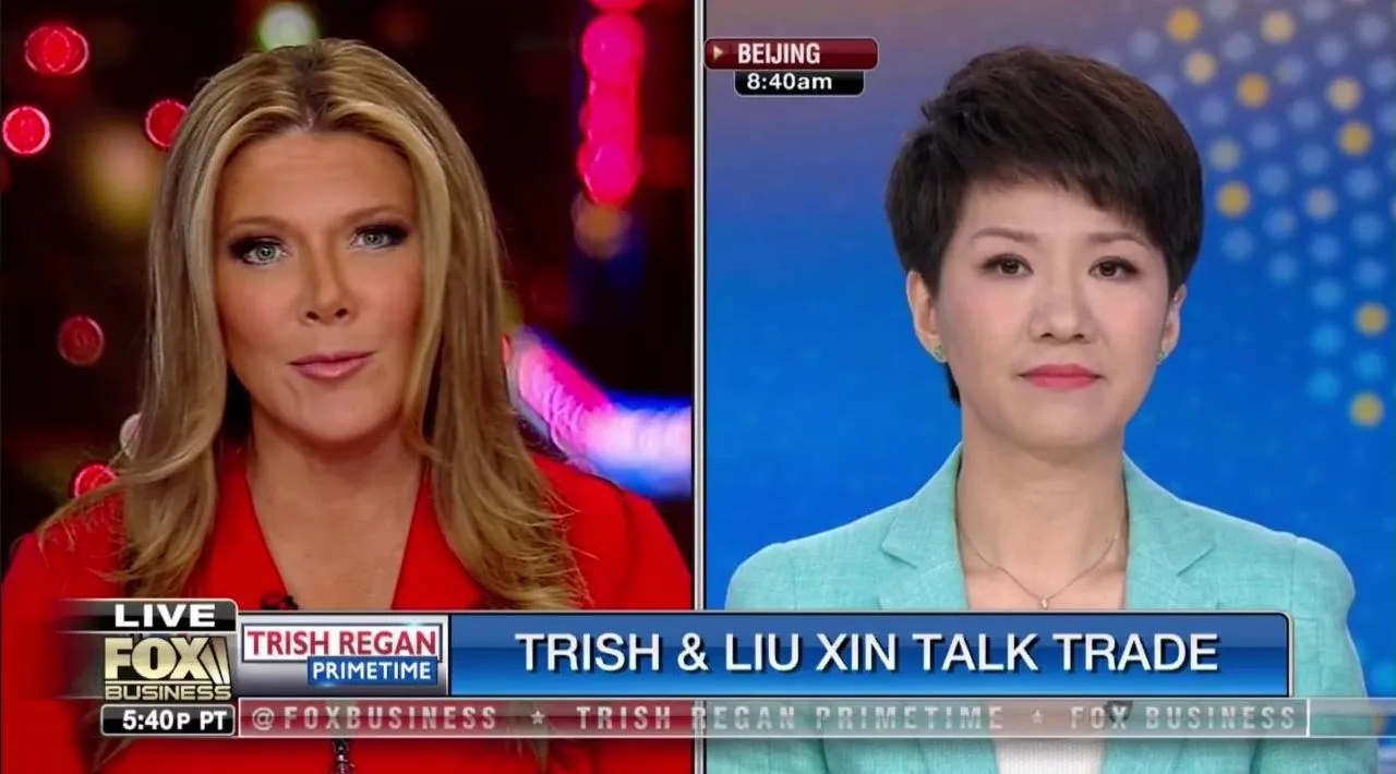 Trish Regan and Liu Xin during their televised debate.
