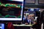 A trader works on the floor of the New York Stock Exchange (NYSE) in New York, U.S