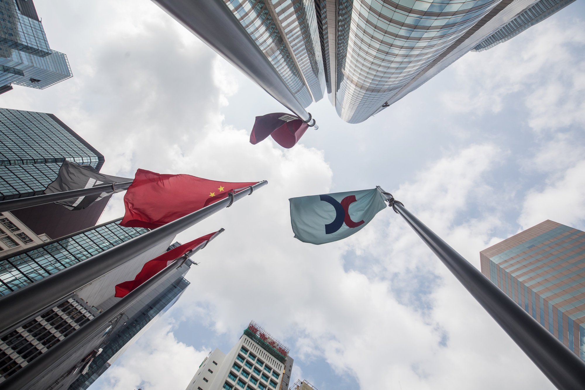 Flags outside the Exchange Square complex in Hong Kong.