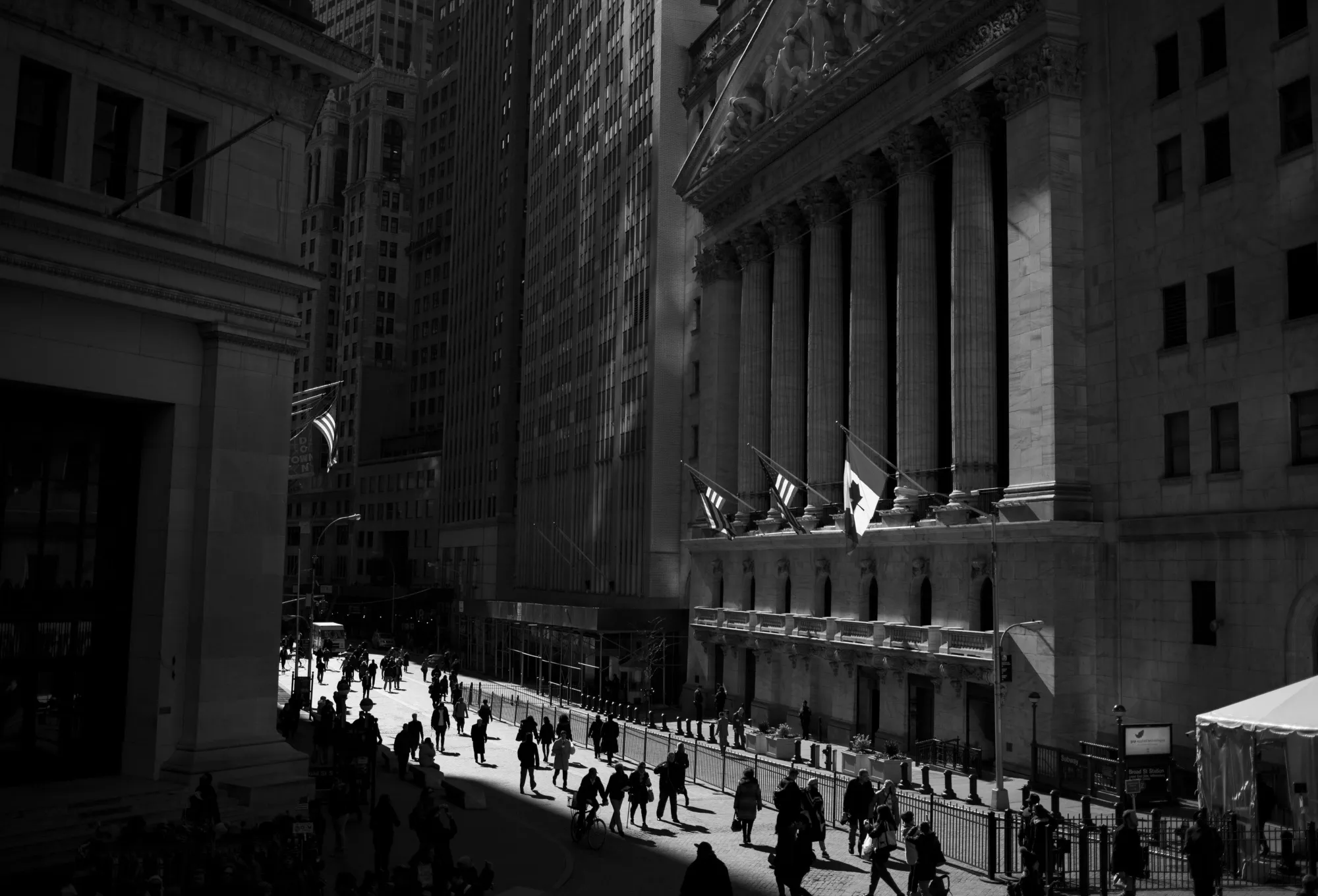 Pedestrians walk past the New York Stock Exchange&nbsp;in New York, U.S.