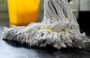 close up photograph of a mop and bucket with shallow depth of field