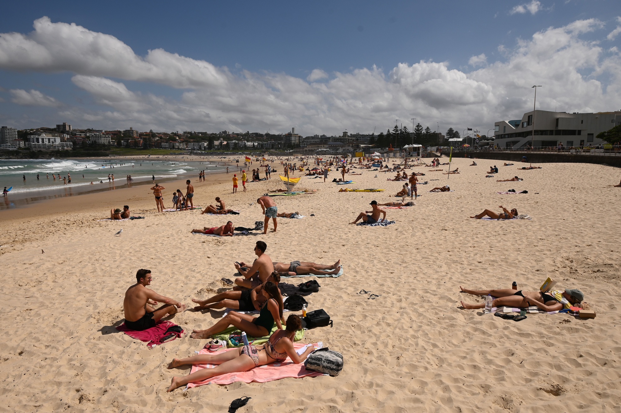 People sunbathe on Bondi Beach ahead of its closure&nbsp;in Sydney on March 21.