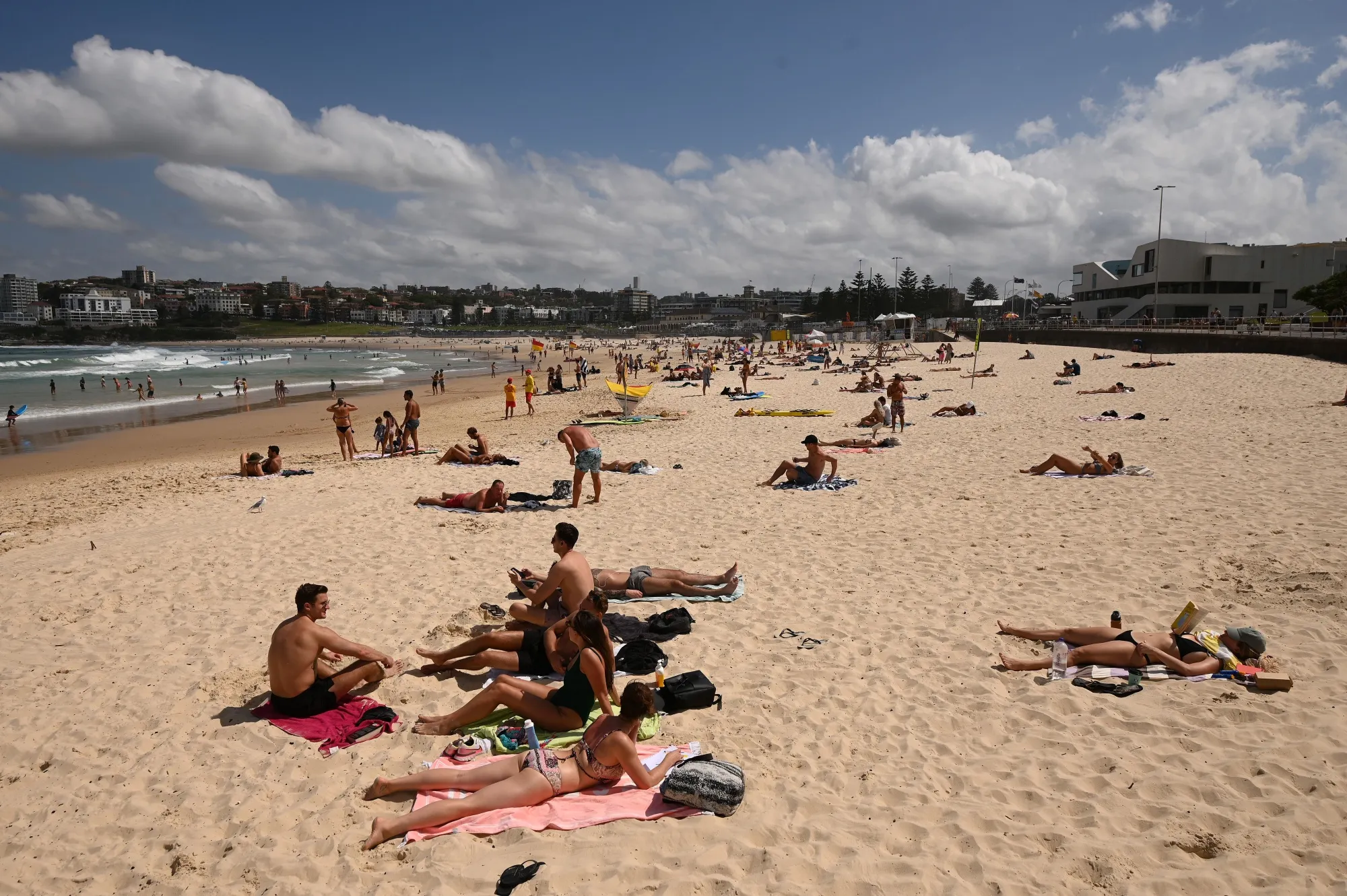 People sunbathe on Bondi Beach ahead of its closure&nbsp;in Sydney on March 21.