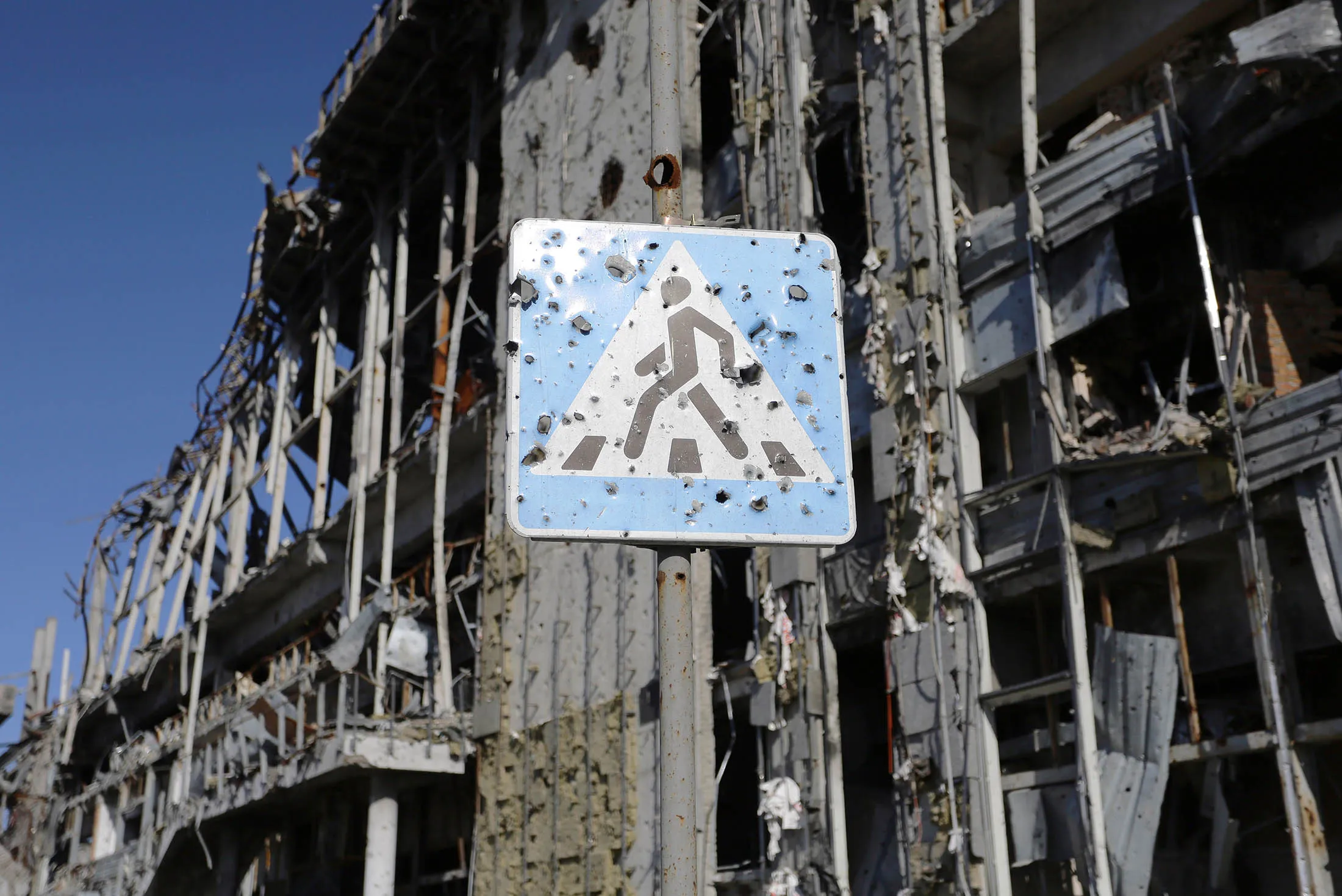 A bullet-ridden road sign stand outside Donetsk international airport.

