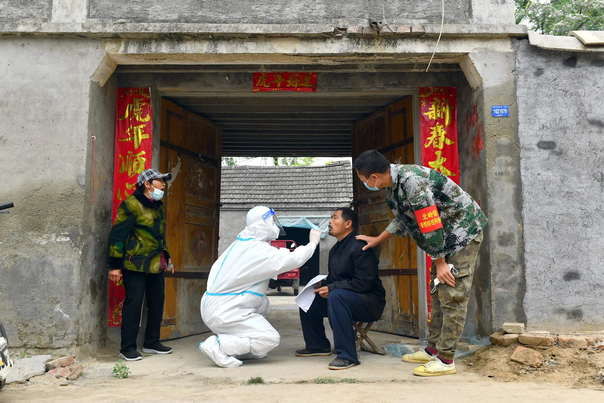 A man is tested for&nbsp;Covid-19&nbsp;at his home in Xiayi in China's central Henan province, on May 10.&nbsp;