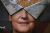 An election campaign poster of Merkel is seen, peeling apart after heavy rains on Sept. 30, one week after Germany’s general election.