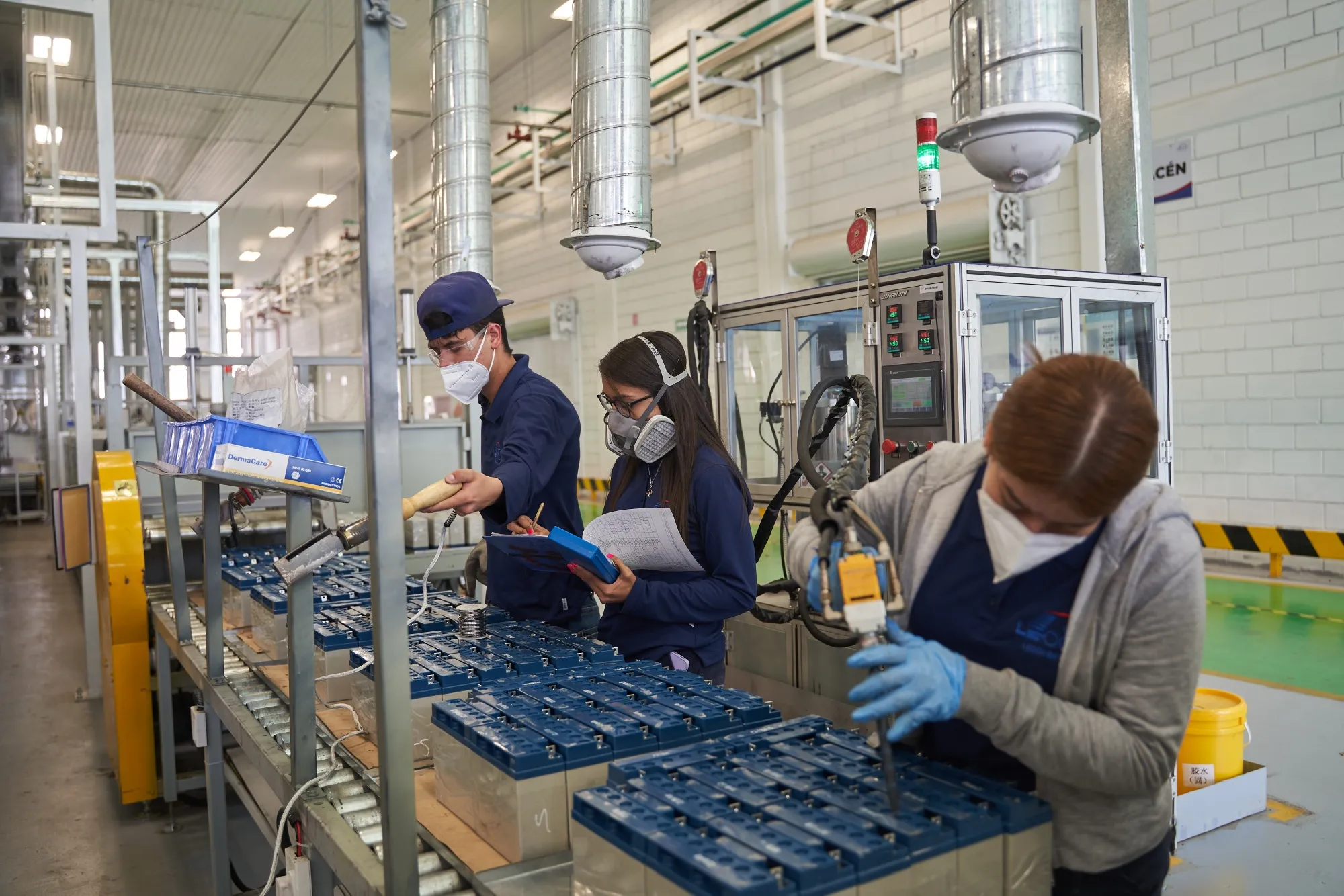 Workers weld acid batteries at a factory in Saltillo, Coahuila, Mexico.