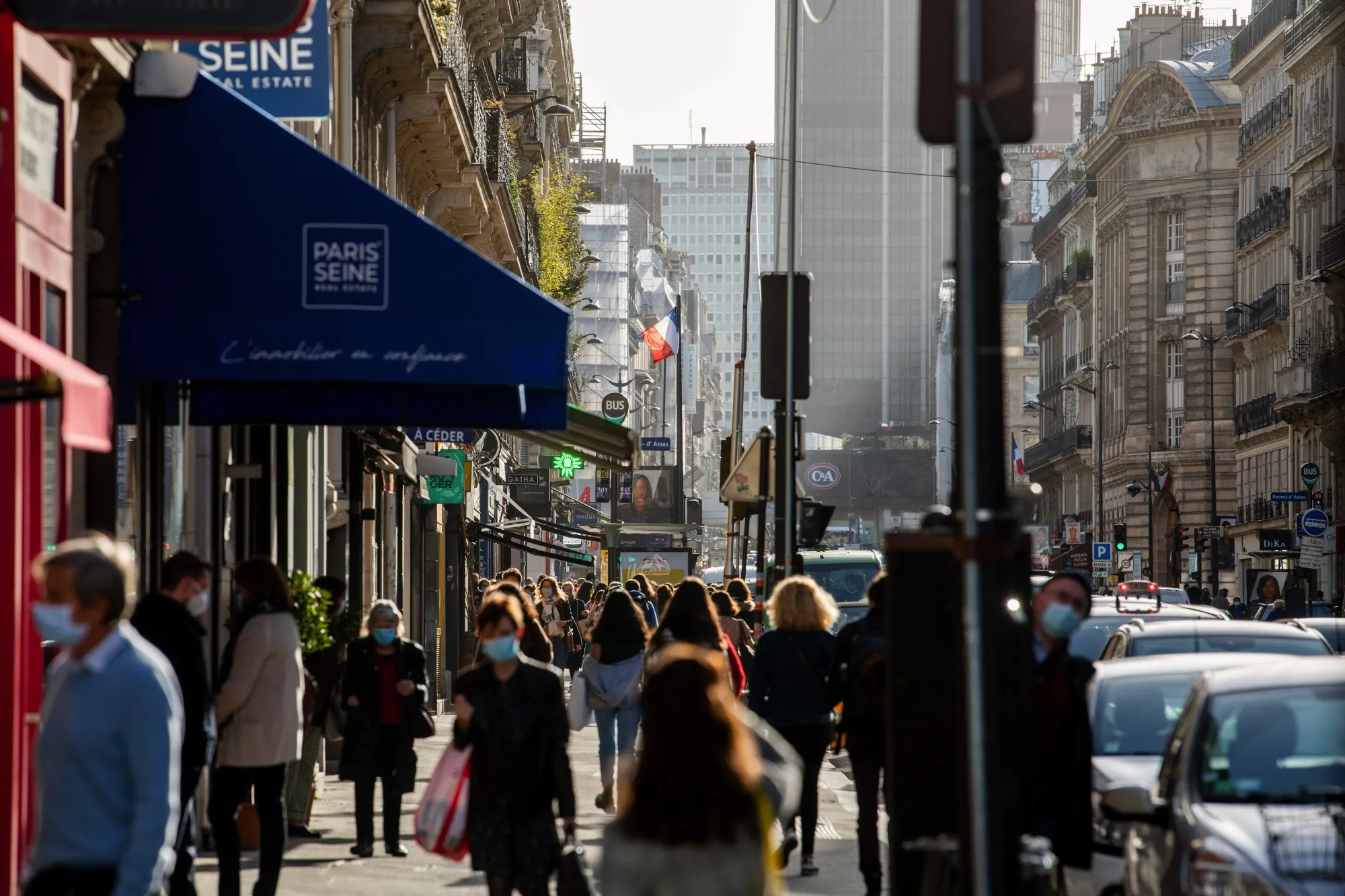 Pedestrians pass along Rue de Rennes in Paris on Feb. 24.