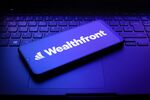 The Wealthfront logo on a smartphone.