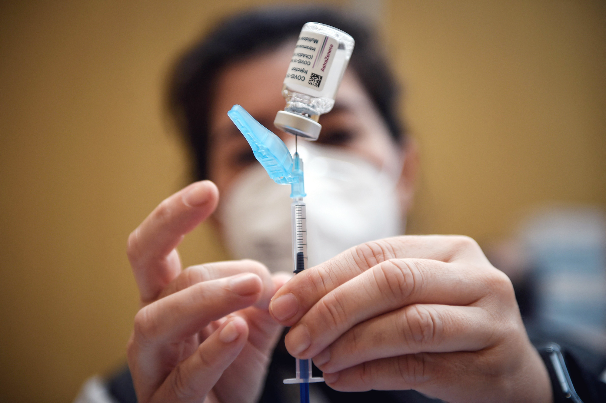 A healthcare worker prepares an AstraZeneca Covid-19 vaccine shot in Vigo, Spain, on March 13.