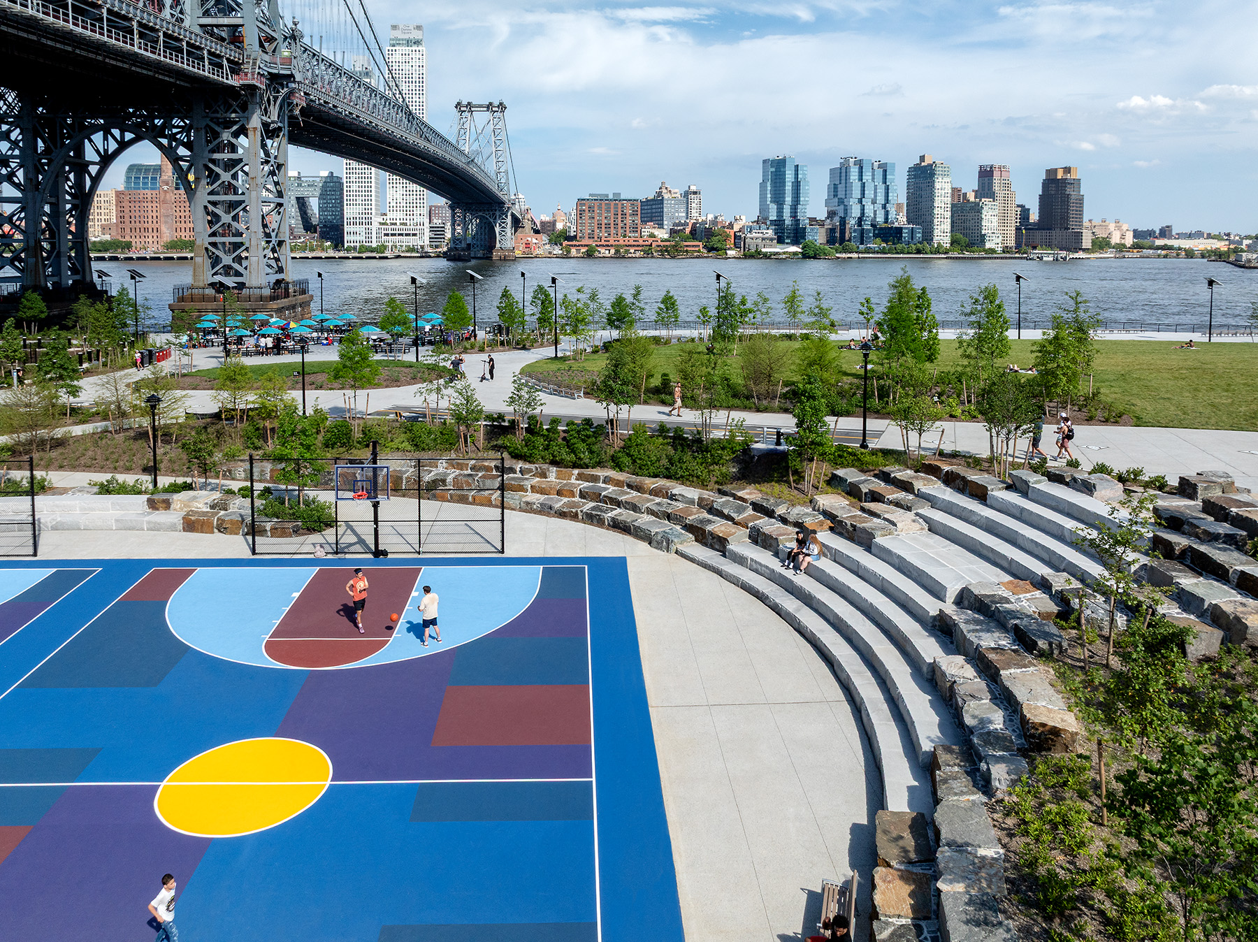 The reconstructed playing fields and green spaces of East River Park have been raised up several feet to better resist flooding. 