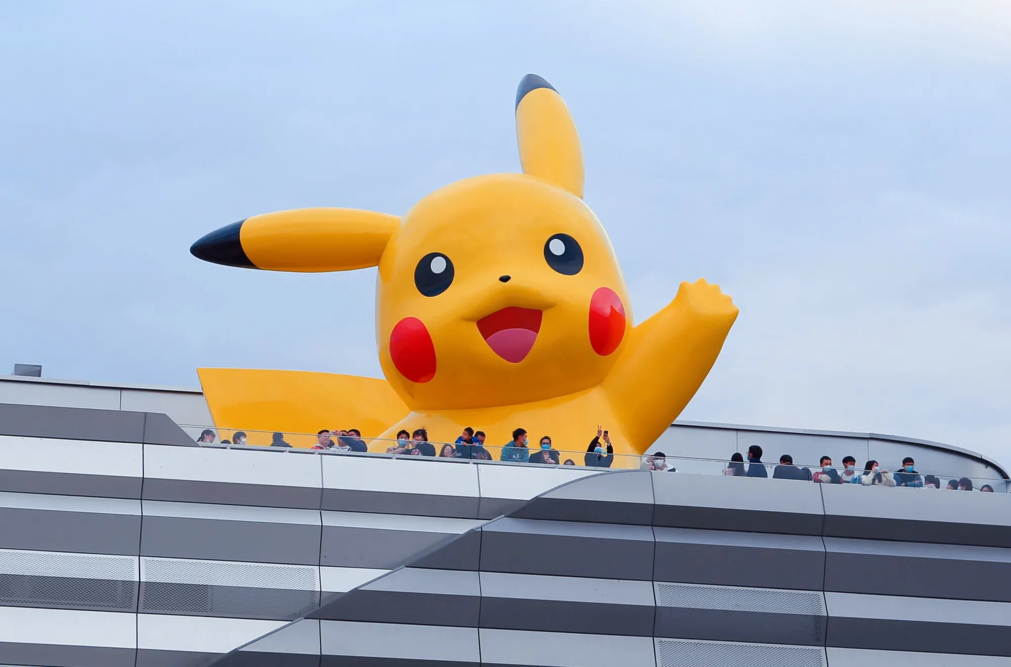 Visitors take pictures of&nbsp;a 10-meter glass and steel Pikachu&nbsp;in Shanghai.