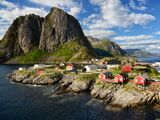 Scenic view of sea by buildings against sky,Reine,Norway