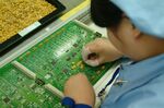 A worker assembles a circuit board at the Huawei Technologies Company Ltd. factory in Shenzhen.