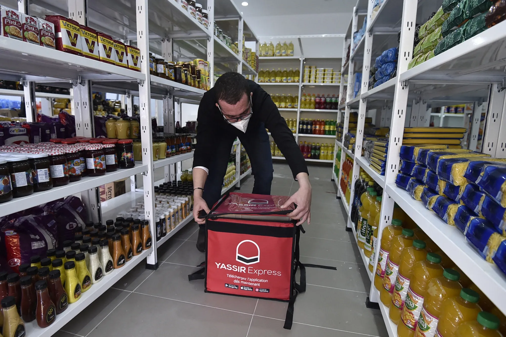 An employee prepares groceries at the Algerian delivery company Yassir, in Algiers.
