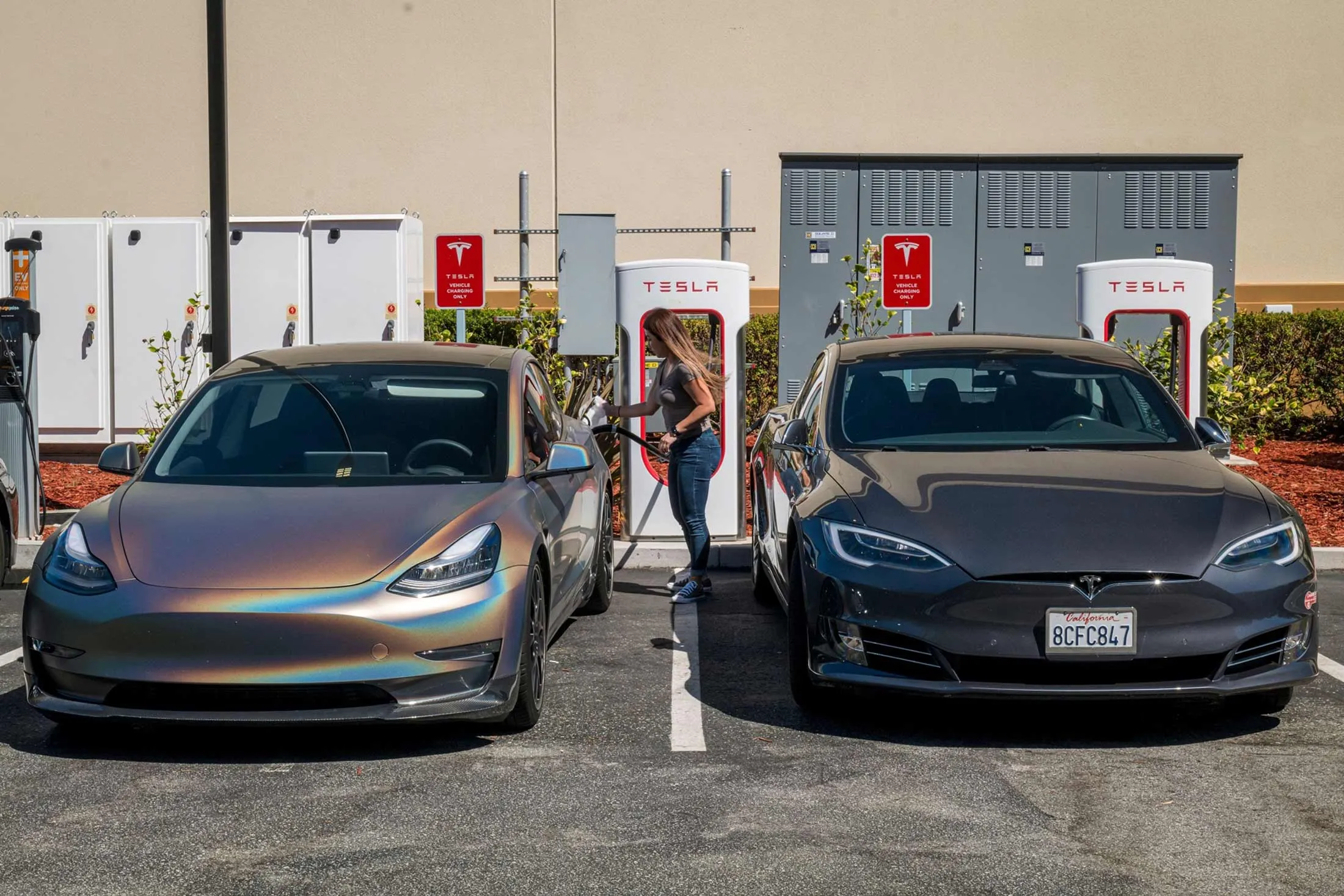 Tesla vehicles at a charging station in San Mateo, Calif.