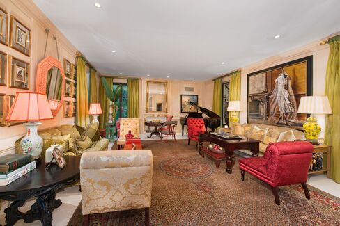 The formal living room blends historic touches with modern color and flair and, like other rooms, was designed for an intimate feel.