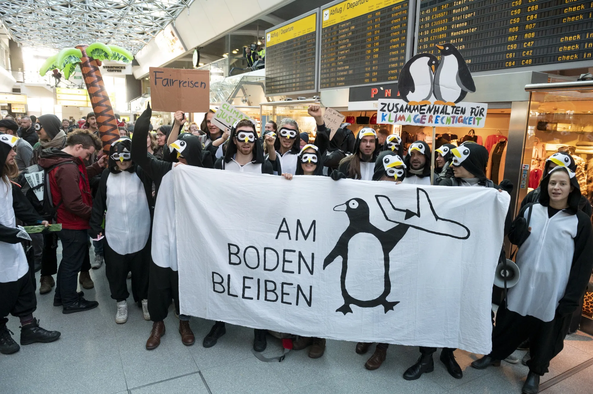 Environmental activists occupy the main hall at Tegel airport in Berlin, on Nov. 10, 2019.